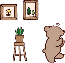 クマと観葉植物、壁にかかっている2枚の絵